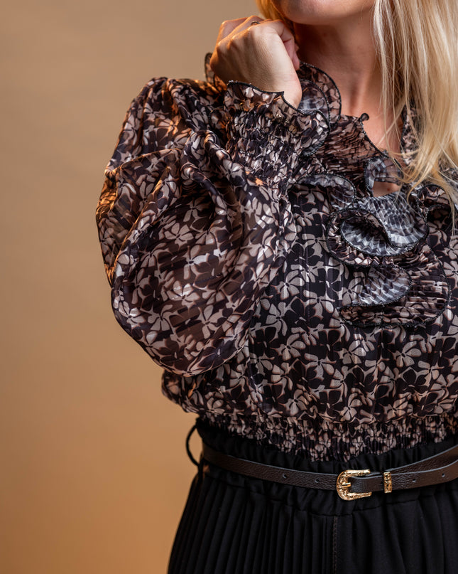 Črna cvetlična bluza z volančki