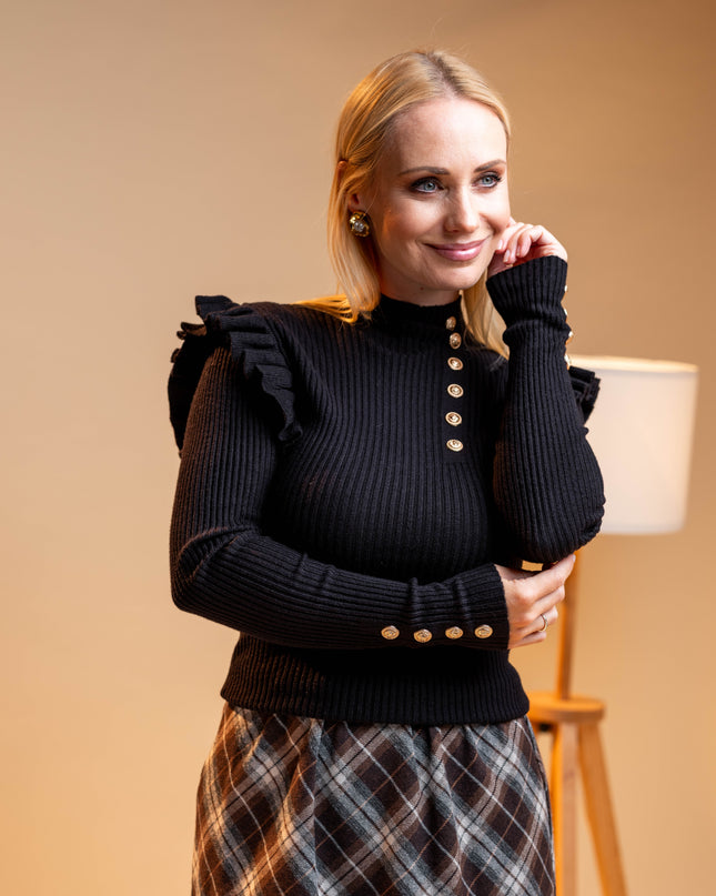 Črn pulover z zlatimi gumbi