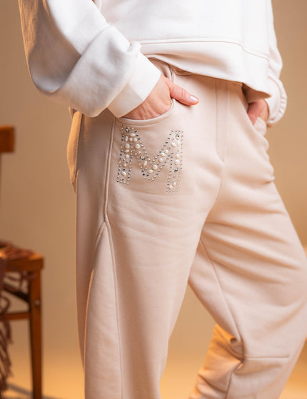 Bombažne hlače v bež barvi