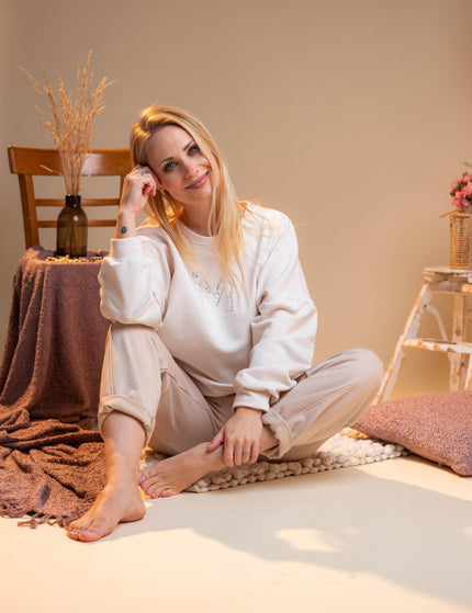 Bombažne hlače v bež barvi